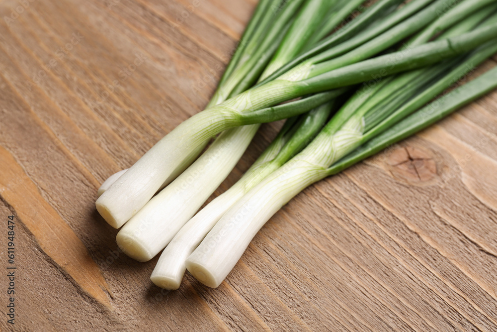 Fresh green onion on wooden background Fresh green onion on wooden background