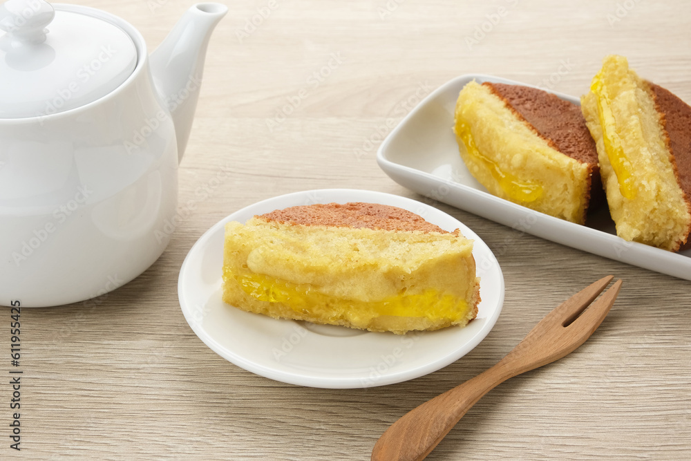 Kue Pukis with pineapple jam, made from flour, yeast, egg, sugar and then baked. Indonesian traditional food
Kue Pukis with pineapple jam, made from flour, yeast, egg, sugar and then baked. Indonesian traditional food