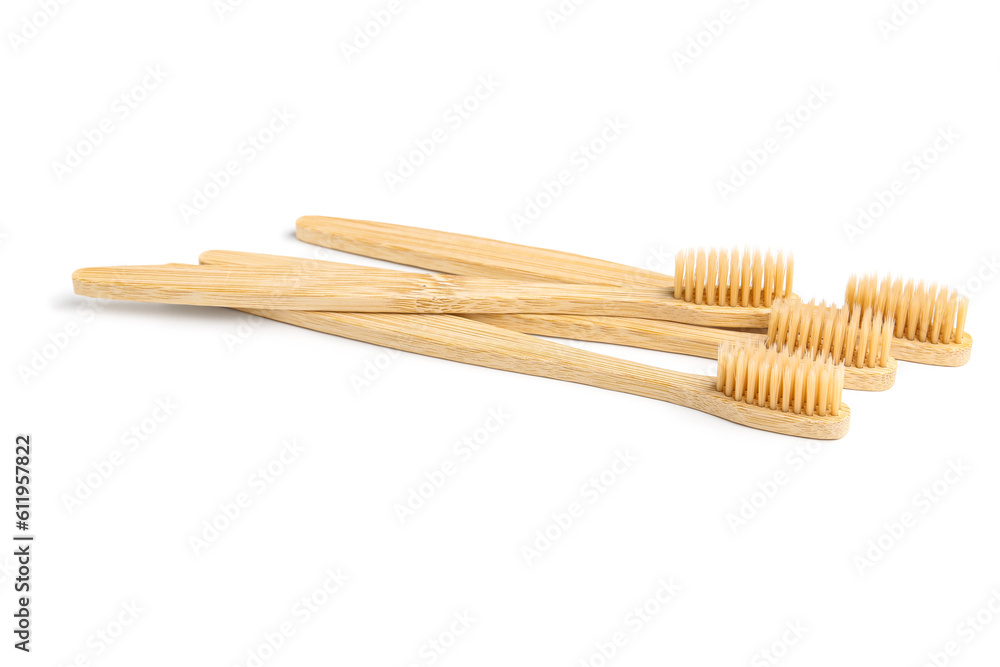 Many bamboo toothbrushes on white background