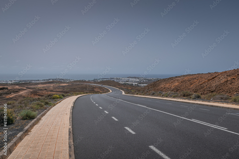 Fototapeta premium Empty LZ-14 road in Costa Teguise direction, Lanzarote