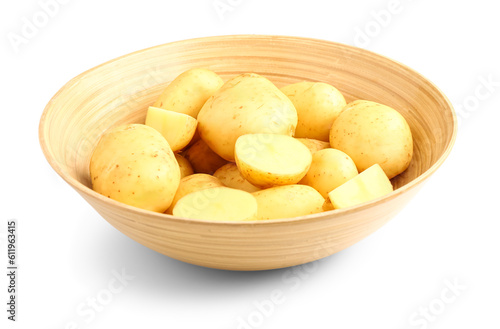 Wooden bowl with raw baby potatoes on white background