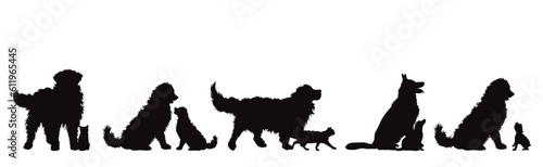 Set of vector silhouettes of different dogs on white background.