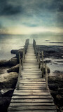 Mysterious and mystical seascape with a rocky cliff and an old wooden bridge, grunge style poster. AI generated.