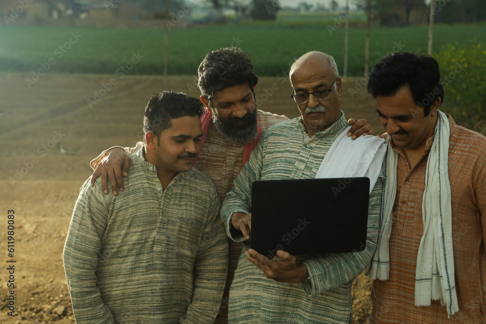 Foto de Beautiful composition of four Indian farmers standing in the ...