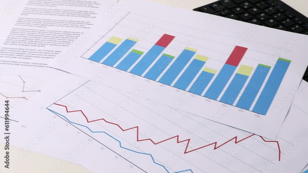 Working office place with graphs and reports. Working office place with graphs and reports.