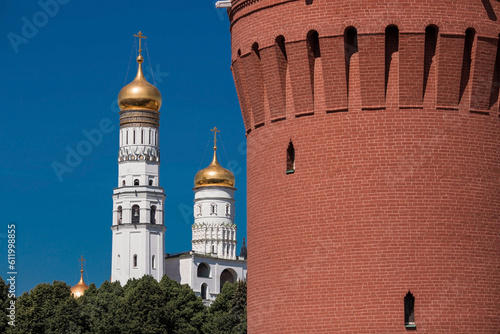 Moscow, Russia, June 2023: View of the bell of Ivan the Great in the Moscow Kremlin behind the Kremlin wall on a sunny summer day.