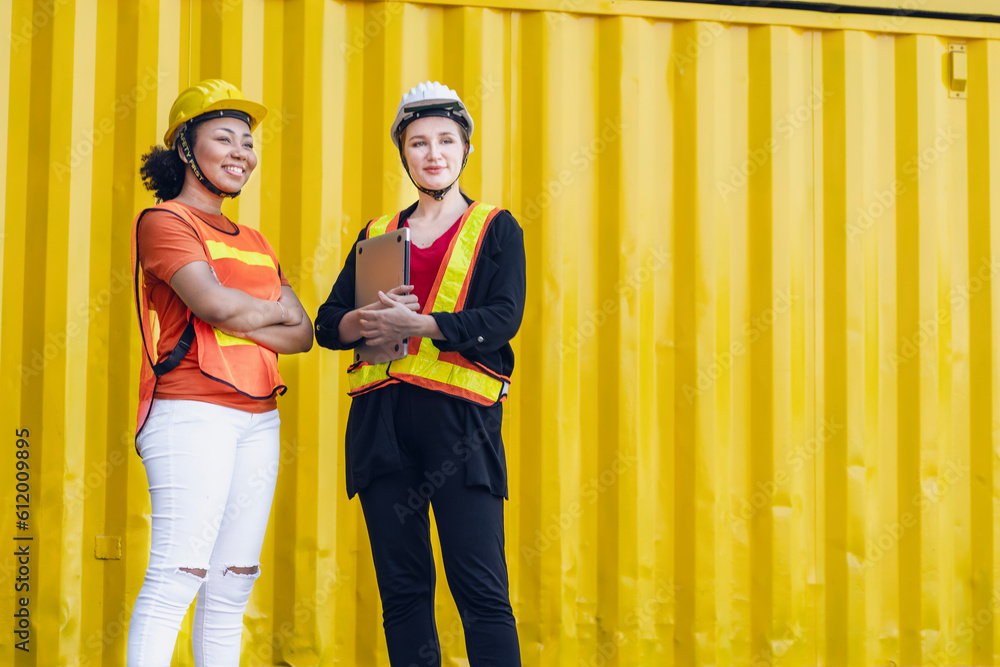 black female employee with arms crossed and a female Caucasian female