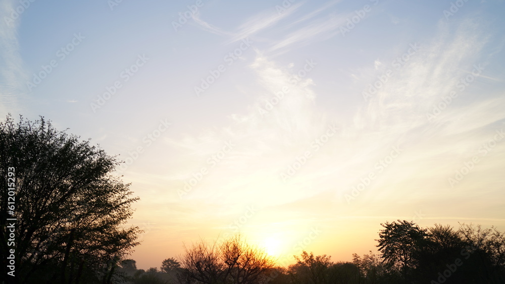 clear sky with orange horizon and blue atmosphere. Smooth orange blue gradient of dawn sky.