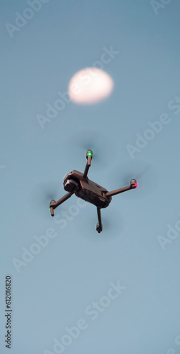drone flying in the sky with full moon background