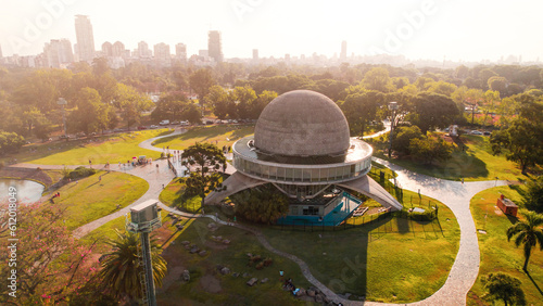 aerial view of green park in the city at sunset