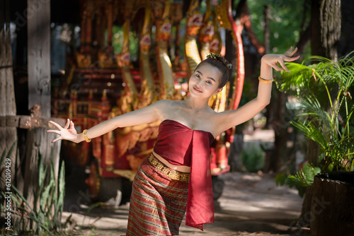 Beautiful Asian woman wearing ancient native Thai traditional dress costumes in ancient Thai dancing called Nang Ram is the noble art of elegance.