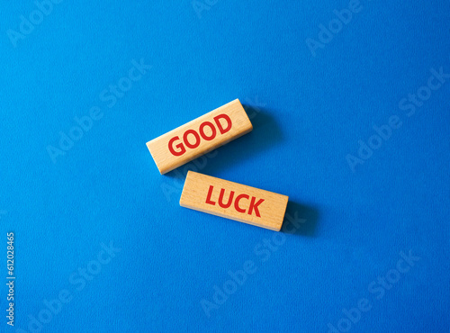 Good luck symbol. Wooden blocks with words Good luck. Beautiful blue background. Business and Good luck concept. Copy space.