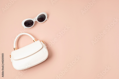 Flat lay with woman fashion accessories, bag and sunglasses. Fashion blog, online store application, summer urban style, shopping and trends concept