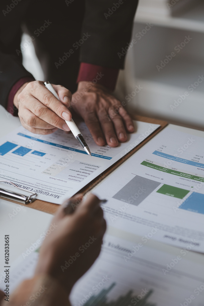 Business man group are meeting together in the office, they are meeting on the topic of finance and financial management, they are business partners. Concept financial management for startup companies Business man group are meeting together in the office, they are meeting on the topic of finance and financial management, they are business partners. Concept financial management for startup companies
