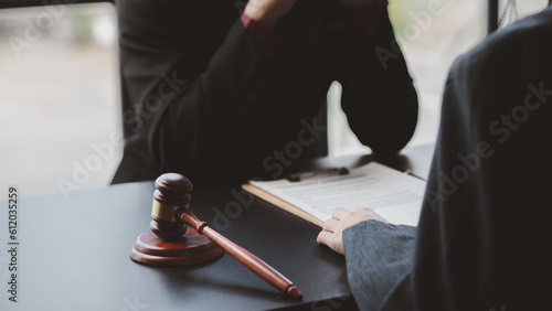 Tableau sur toile Attorneys or lawyers are advising clients in defamation cases, they are collecting evidence to bring charges against the parties for damages
