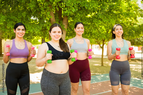 Beautiful happy women enjoying an outdoors workout celebrating body positivity