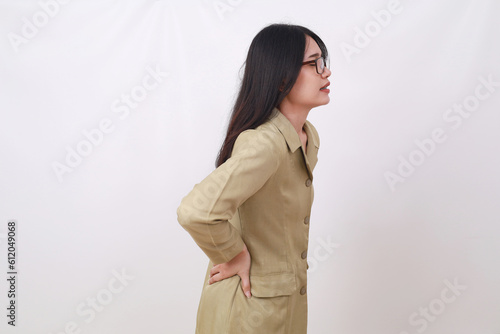 Side view of civil servant woman suffering from back pain.