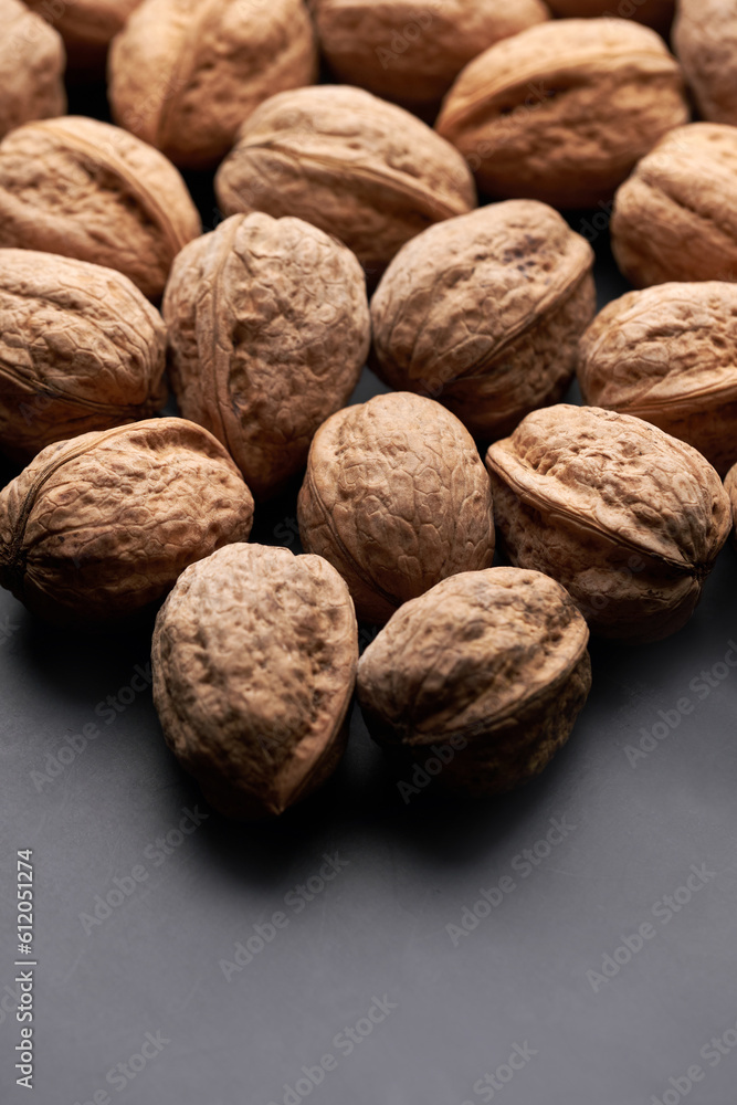 Whole walnuts nuts with shells close-up background studio shot Whole walnuts nuts with shells close-up background studio shot