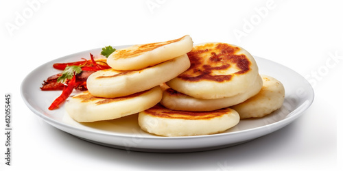 Roasted traditional corn arepas on white plate, isolated on white background. Ai generated