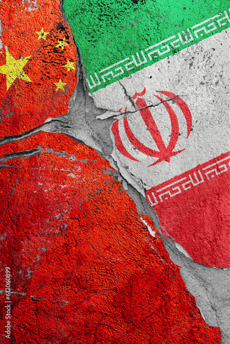 Photography Illustration of crack between flags of China and Iran, the concept of global cri