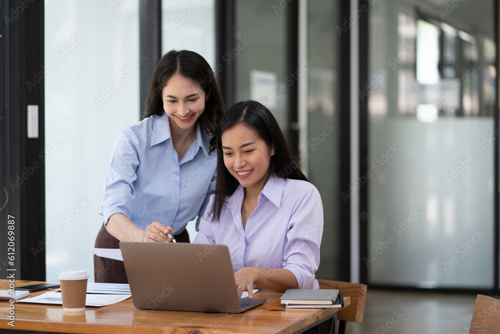 Businesswoman working with female colleagues inside the office. Businesswoman working with female colleagues inside the office.