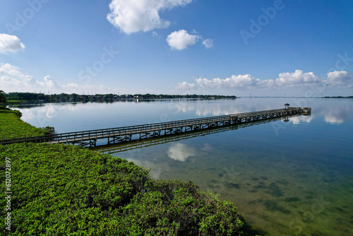 A drone photo of fishing pier in Tampa Bay  Florida. An aerial view of the natural beauty of a city park.