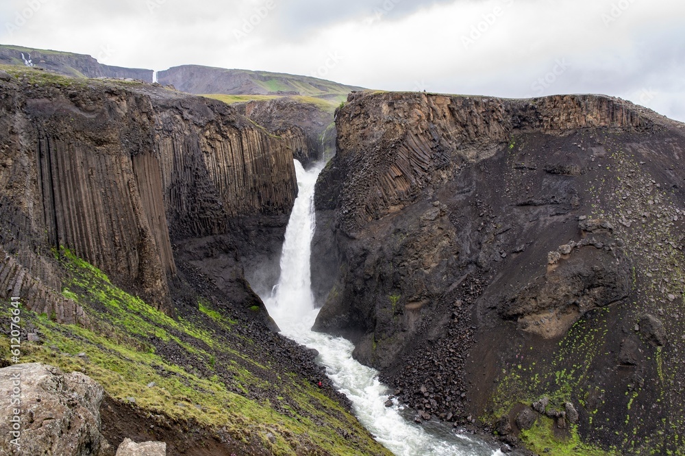 Litlanesfoss waterfall in Iceland with its basaltic geologic landscape in cloudy weather Litlanesfoss waterfall in Iceland with its basaltic geologic landscape in cloudy weather