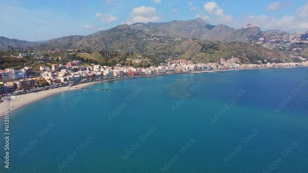 View with Giardini Naxos and Taormina, Sicily. Beach and sea in summer View with Giardini Naxos and Taormina, Sicily. Beach and sea in summer
