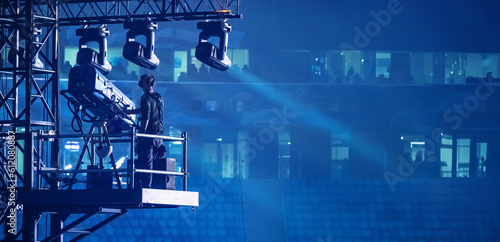 A man controls the lighting...