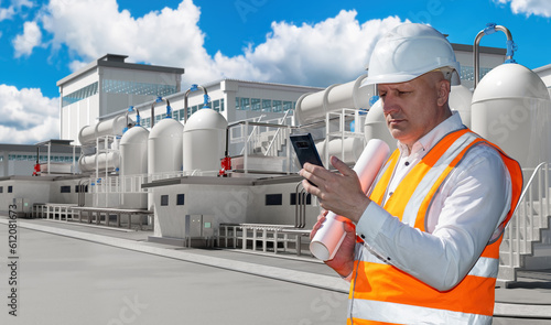 Builder near factory. Man w...