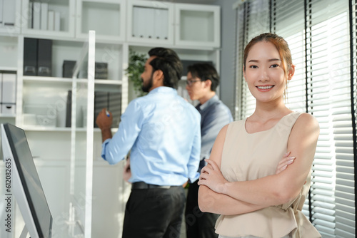 Young confident smiling Asian business woman leader, Successful business woman looking confident and smiling. Free Download Young confident smiling Asian business woman leader, Successful business woman looking confident and smiling. - GFXLoad