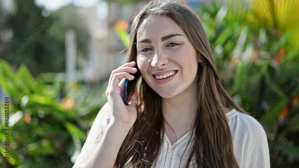 Young beautiful hispanic woman smiling confident talking on smartphone at park Young beautiful hispanic woman smiling confident talking on smartphone at park