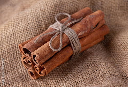 a bunch of cinnamon sticks on a sackcloth, close-up
