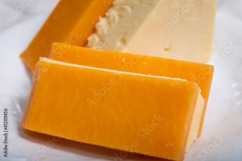 British cheeses collection, Scottish coloured and English matured cheddar cheeses close up
