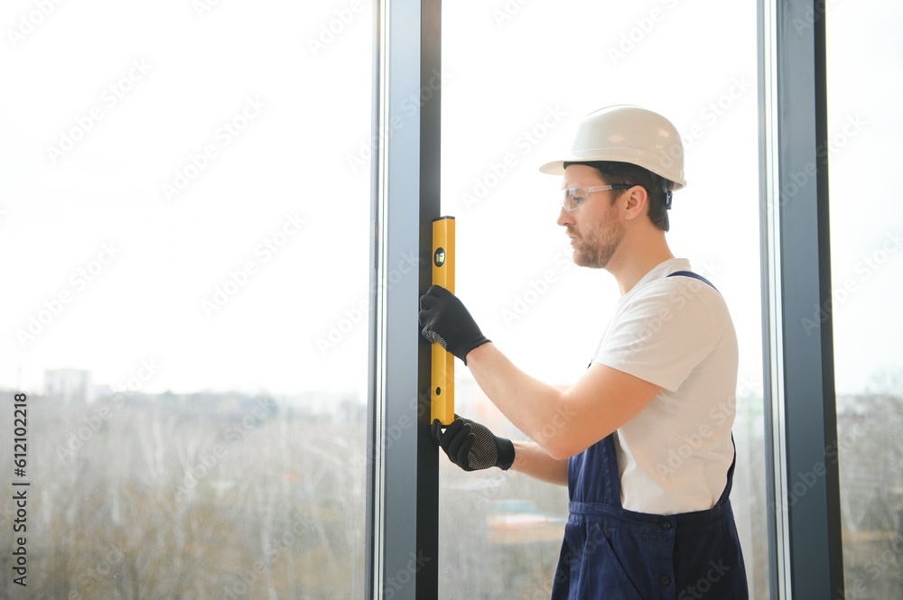 worker installing new plastic pvc window worker installing new plastic pvc window
