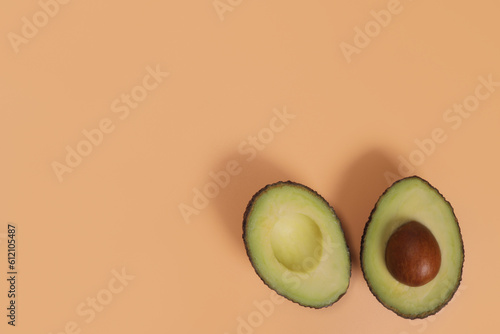 avocado hass with a stone on a light background, the concept of proper nutrition