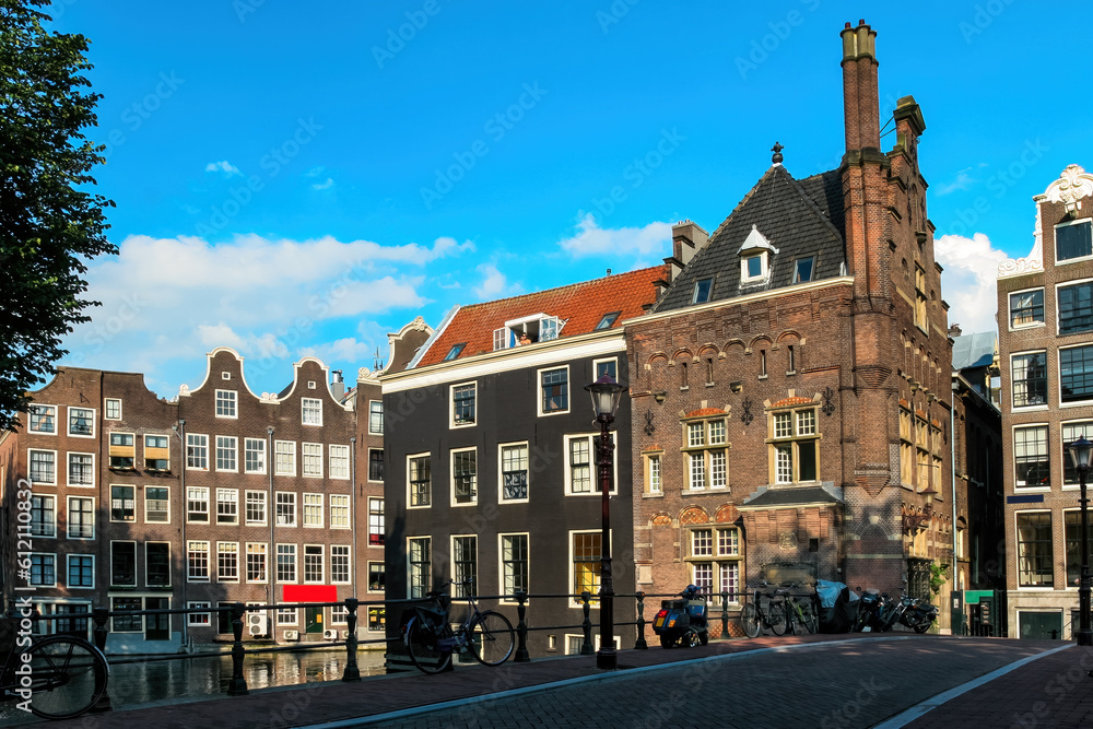 Old building and bridge over canal in Amsterdam, Netherlands.