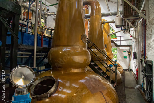 Copper stills in a whisky distillery in Tobermory on the Isle of Mull photo