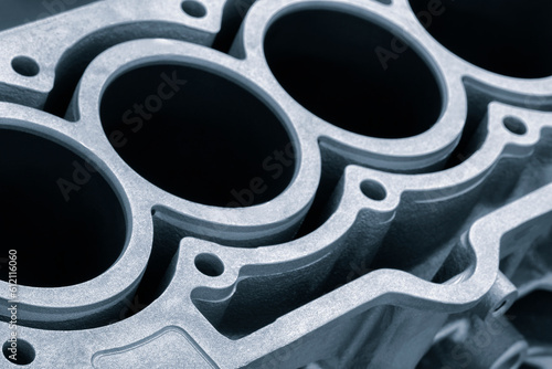 cylinder block of diesel engine repair. Close-up of the cylinder block in blue tone. Car engine cylinder heads. Industry car service concept blue tone background