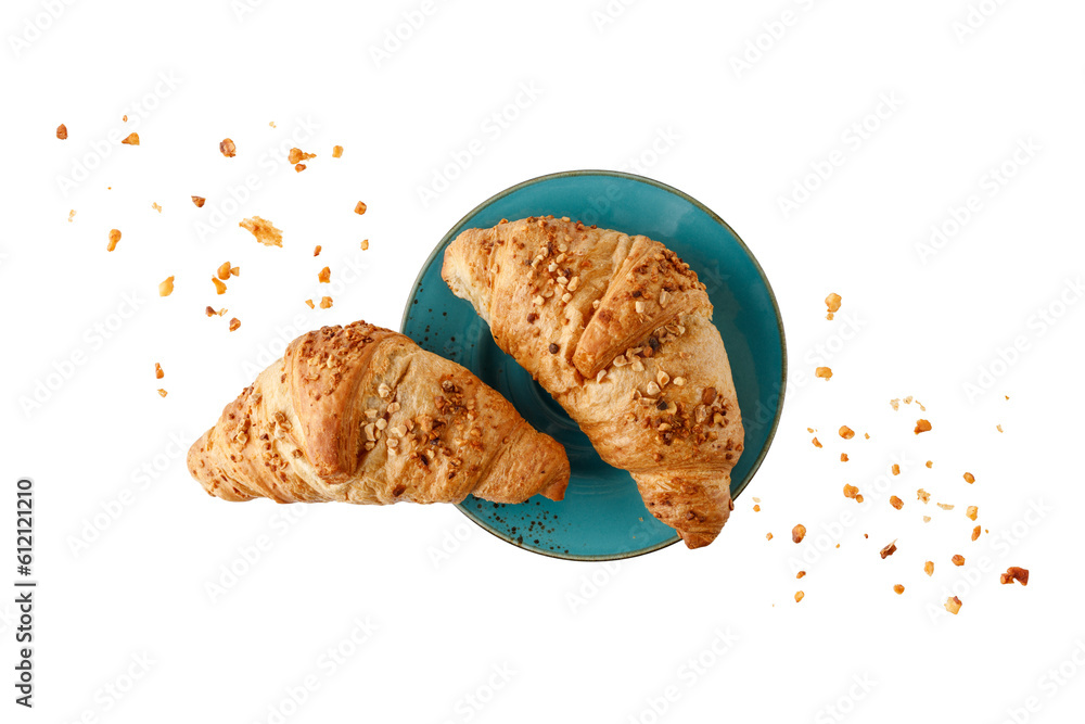 Φωτογραφία Fresh baked almond nuts croissants with crumbs on vintage blue green plate isolated on white background