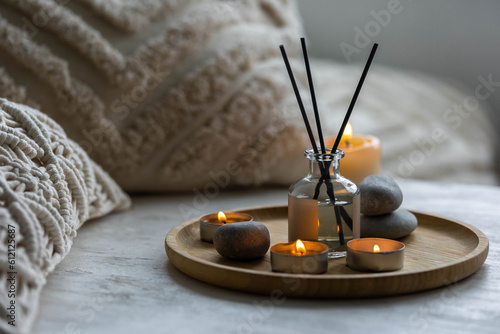 Aromatherapy, atmosphere of relax, serenity and pleasure. Concept of spa treatment in salon. Natural organic essential oil, towel, burning candles. Anti-stress, detox procedure, wellness