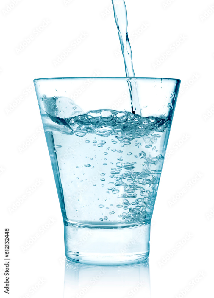 pouring water on a glass on white background pouring water on a glass on white background