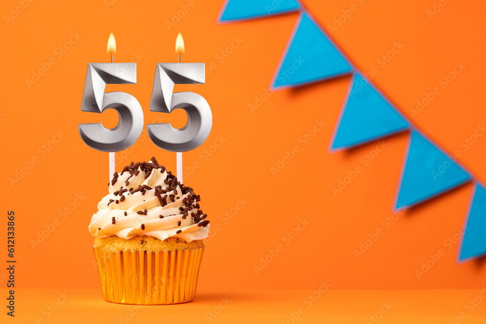 Birthday cake with candle number 55 - Orange background