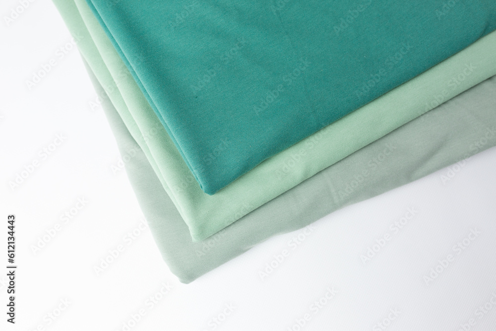 Knitted fabric of different colors, fabric on a white background. Knitted fabric of different colors, fabric on a white background.