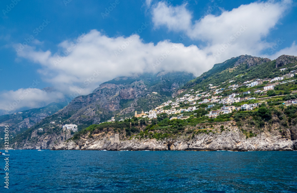 Amalfi Coast from a boat, a beautiful view on a summer day, Italy