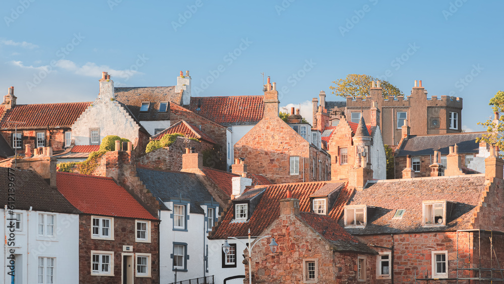 Quaint red brick buildings, chimneys, and rooftops in the  historic, East Neuk fishing village of Crail, Fife, Scotland, UK.