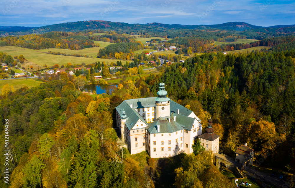 Aerial view of Lemberk Castle in autumn forest in Lusatian Mountains, near Czech village of Lvova