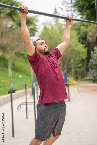 Man exercising doing barbells