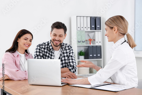 Couple having appointment with fertility doctor in clinic. Patient consultation