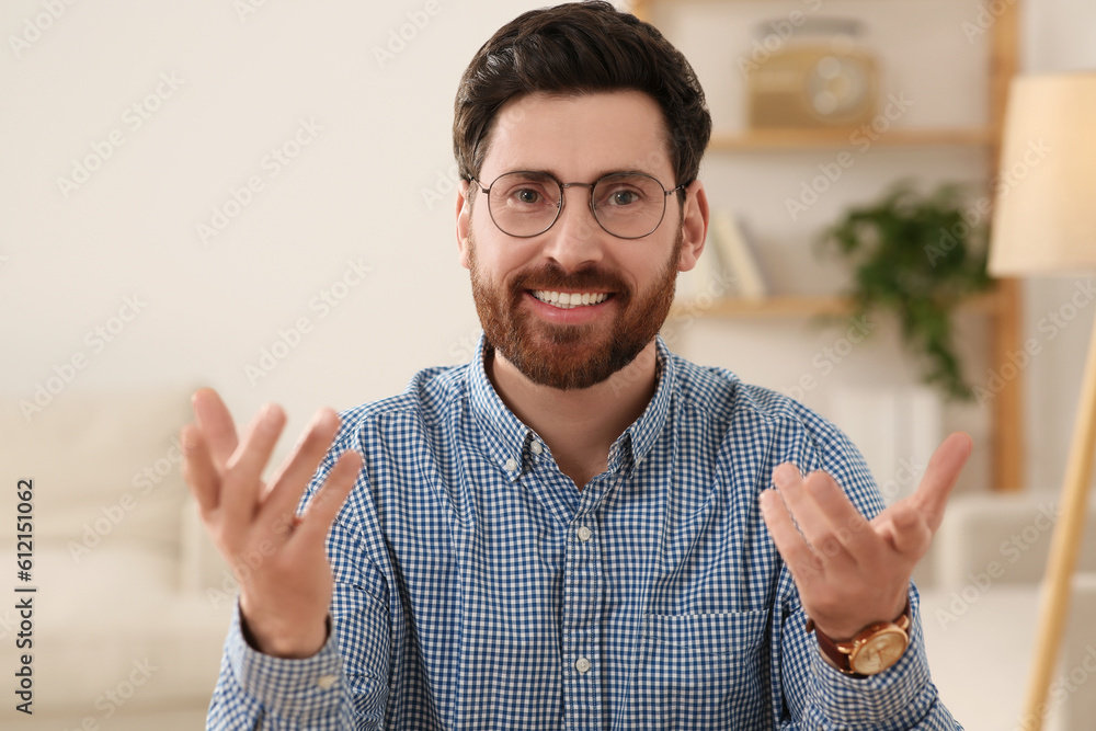 Happy man having video call at home, view from web camera Happy man having video call at home, view from web camera